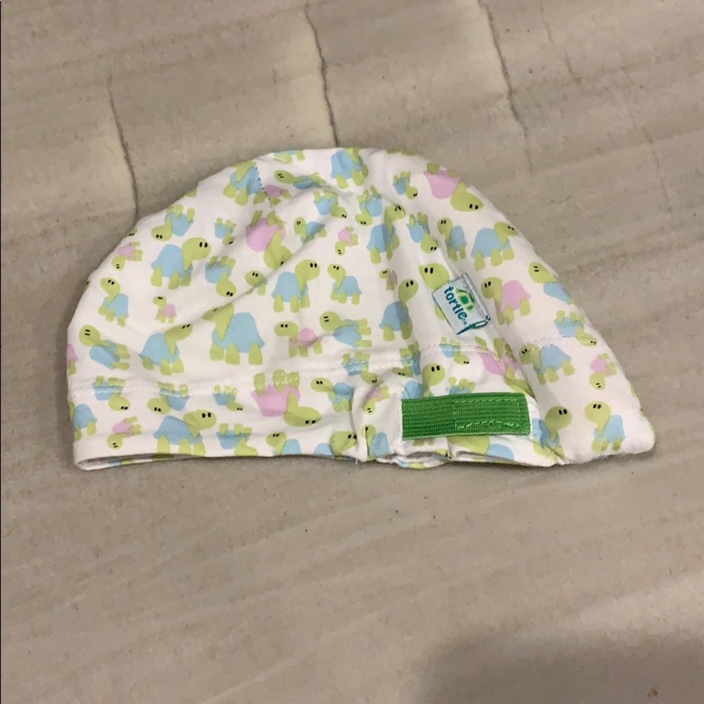 Infant tortle hat for torticollis.